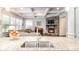 Granite countertop kitchen island, stainless steel appliances, and white shaker cabinets at 1320 Torrens Dr, Wesley Chapel, NC 28110