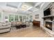Spacious living room with stone fireplace, high ceilings, and hardwood floors at 1320 Torrens Dr, Wesley Chapel, NC 28110