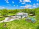 Serene property showcasing a stylish home, vibrant green lawns, and ample recreational space, perfect for Gathering living and entertaining at 15700 Youngblood Rd, Charlotte, NC 28278
