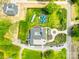 Stunning aerial view of a modern home featuring a backyard oasis with a pool and a meticulously landscaped yard at 15700 Youngblood Rd, Charlotte, NC 28278