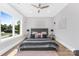 Bright bedroom features a large window, ceiling fan, and stylish decor at 15700 Youngblood Rd, Charlotte, NC 28278