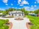 Striking home with circular driveway, lush landscaping, and modern design creating a grand and inviting curb appeal at 15700 Youngblood Rd, Charlotte, NC 28278