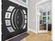 Modern front door with unique design and bright entryway at 15700 Youngblood Rd, Charlotte, NC 28278