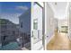 Hallway with doors to outdoor balcony overlooking a gorgeous pool at 15700 Youngblood Rd, Charlotte, NC 28278