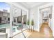 Bright hallway with views of a modern pool area, perfect for indoor/outdoor living at 15700 Youngblood Rd, Charlotte, NC 28278
