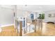 Bright hallway with hardwood floors, modern railing, and plenty of natural light at 15700 Youngblood Rd, Charlotte, NC 28278