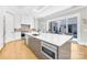 Open concept kitchen featuring a large island, stainless appliances, and outdoor views at 15700 Youngblood Rd, Charlotte, NC 28278