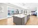 Open concept kitchen and outdoor view, featuring a large island with seating at 15700 Youngblood Rd, Charlotte, NC 28278