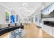 Spacious living room features hardwood floors, modern lighting, and a cozy fireplace at 15700 Youngblood Rd, Charlotte, NC 28278