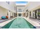 Inviting outdoor pool surrounded by stylish lounge furniture and modern architectural design, perfect for relaxation at 15700 Youngblood Rd, Charlotte, NC 28278