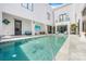 Serene outdoor pool area showcasing contemporary architecture, a pristine pool, and chic lounge seating at 15700 Youngblood Rd, Charlotte, NC 28278