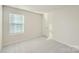 Bright bedroom with window, blinds, and neutral carpeting at 1715 Wooten Way, Bessemer City, NC 28016