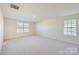 Spacious bedroom with neutral carpet and large windows at 1715 Wooten Way, Bessemer City, NC 28016