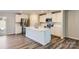 Modern kitchen with white cabinets, quartz countertops, and a kitchen island at 1715 Wooten Way, Bessemer City, NC 28016