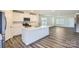 Open concept kitchen with island and stainless steel appliances at 1715 Wooten Way, Bessemer City, NC 28016