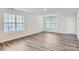 Bright living room with hardwood floors and neutral walls at 1715 Wooten Way, Bessemer City, NC 28016