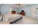 Bedroom featuring soft blue walls, carpet, a ceiling fan, and two dressers at 3302 Cole Mill Rd, Charlotte, NC 28270