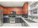 Bright kitchen with stainless steel appliances, updated countertops and stylish backsplash at 3302 Cole Mill Rd, Charlotte, NC 28270