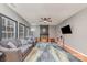 Spacious living room featuring neutral gray walls, a fireplace, ceiling fan, and beautiful hardwood floors at 3302 Cole Mill Rd, Charlotte, NC 28270