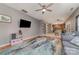 Open-concept living room flows into kitchen, featuring modern design, hardwood floors, and natural light at 3302 Cole Mill Rd, Charlotte, NC 28270