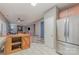 Open-concept living room adjacent to a kitchen with stainless steel refrigerator at 3302 Cole Mill Rd, Charlotte, NC 28270
