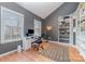 Bright home office with a vaulted ceiling, large window, and built-in shelving at 3302 Cole Mill Rd, Charlotte, NC 28270