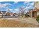 A charming neighborhood street view shows the house with nearby homes in a Gathering friendly community at 3302 Cole Mill Rd, Charlotte, NC 28270