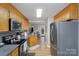 Modern kitchen with stainless steel appliances and hardwood floors at 3374 White Oak Ct, Claremont, NC 28610