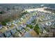 Serene aerial view of a residential neighborhood with lake access and meticulously landscaped yards at 375 Montibello Dr, Mooresville, NC 28117