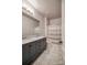 Well-lit bathroom features a double vanity and shower with a decorative curtain at 375 Montibello Dr, Mooresville, NC 28117