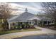 Elegant clubhouse featuring classic architecture with a well-manicured lawn and inviting entrance at 375 Montibello Dr, Mooresville, NC 28117