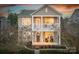 Charming two-story home with a welcoming front porch and second story balcony, perfect for enjoying the evening sunset at 375 Montibello Dr, Mooresville, NC 28117