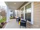 Charming front porch featuring two chairs, offering a relaxing outdoor space with ample natural light at 375 Montibello Dr, Mooresville, NC 28117
