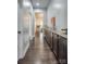 Hallway features hardwood floors, built-in cabinets with granite countertops, and decorative accents at 375 Montibello Dr, Mooresville, NC 28117