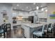 Modern kitchen with stainless steel appliances, large center island, and sleek cabinets at 375 Montibello Dr, Mooresville, NC 28117