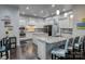 Modern kitchen features granite countertops, stainless steel appliances, and a kitchen island with bar seating at 375 Montibello Dr, Mooresville, NC 28117
