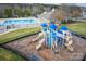 Community playground featuring slides and climbing structures, adjacent to a swimming pool and clubhouse at 375 Montibello Dr, Mooresville, NC 28117