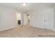 Bright bedroom featuring neutral carpeting and multiple entryways for added convenience at 4021 Harmattan Dr, Denver, NC 28037