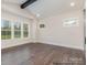 Bedroom with hardwood floors and two large windows at 4021 Harmattan Dr, Denver, NC 28037