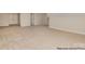 Large bonus room featuring neutral carpeting and multiple doorways, ideal for flexible living space at 4021 Harmattan Dr, Denver, NC 28037