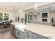 Modern kitchen featuring stainless steel appliances, farmhouse sink, and an adjacent dining area at 4021 Harmattan Dr, Denver, NC 28037