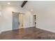 Stylish living room featuring hardwood floors, barn door access, and ample natural light at 4021 Harmattan Dr, Denver, NC 28037