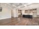 Open concept living room with hardwood floors and access to the kitchen at 4021 Harmattan Dr, Denver, NC 28037