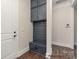 Efficient mudroom with built-in storage, coat hooks, and bench seating near the entry at 4021 Harmattan Dr, Denver, NC 28037