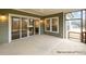 Screened porch with a sliding glass door to the kitchen and a view of the backyard at 4021 Harmattan Dr, Denver, NC 28037