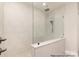 Modern shower with a glass enclosure and rainfall shower head, highlighting bathroom design at 4021 Harmattan Dr, Denver, NC 28037