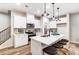 Modern kitchen with white cabinets and a large island at 4110 Cheyney Park Dr, Charlotte, NC 28269