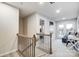 Upper level features a landing, access to private balcony, and a view into a bedroom at 4110 Cheyney Park Dr, Charlotte, NC 28269