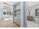 Open bathroom with built in shelves, light blue walls, and natural sunlight streaming in at 722 Hillside Ave, Charlotte, NC 28209