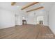 Expansive bonus room with wooden beams, a bar area, and plenty of space for entertaining at 722 Hillside Ave, Charlotte, NC 28209